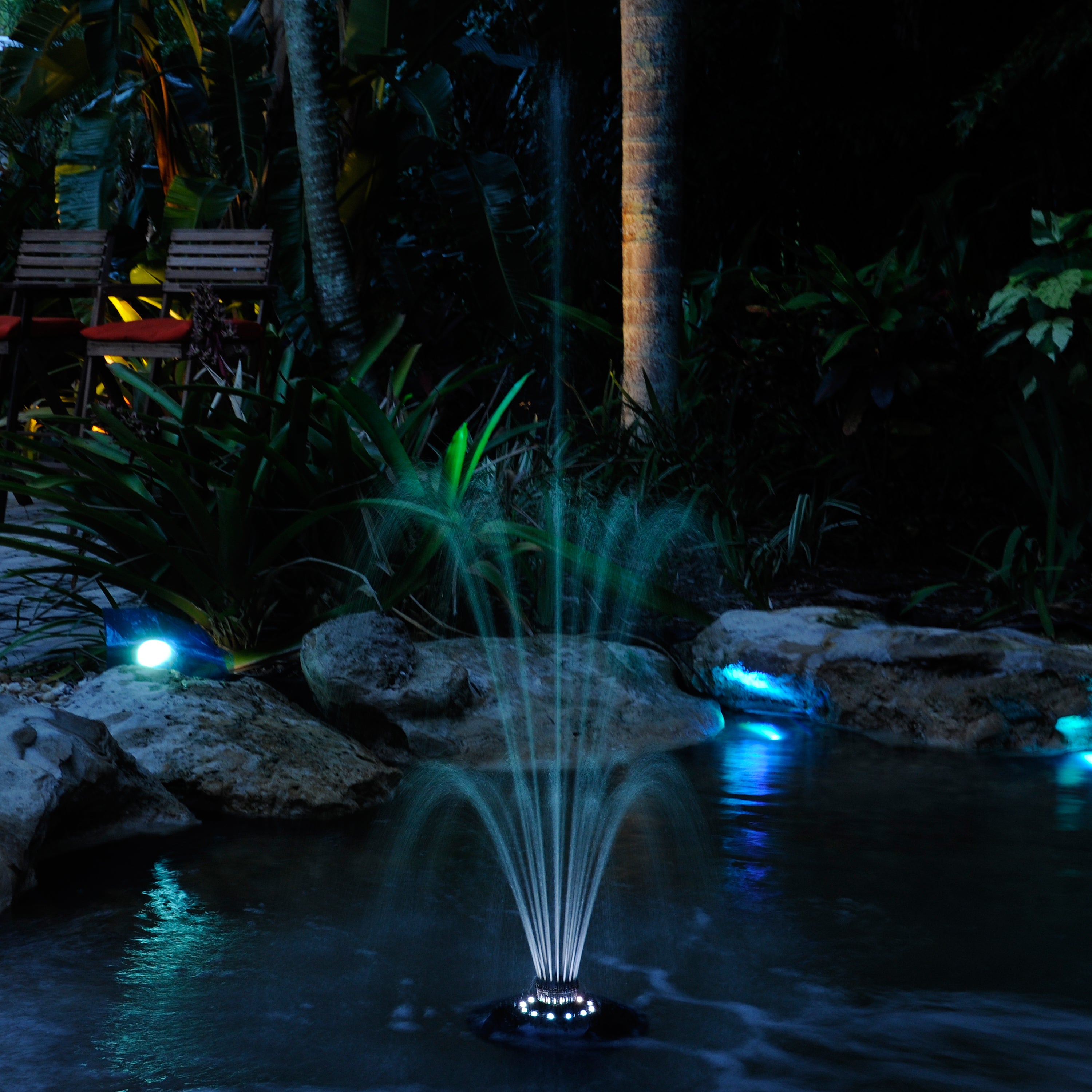 Floating Fountain with White LED Lights in Use at Night